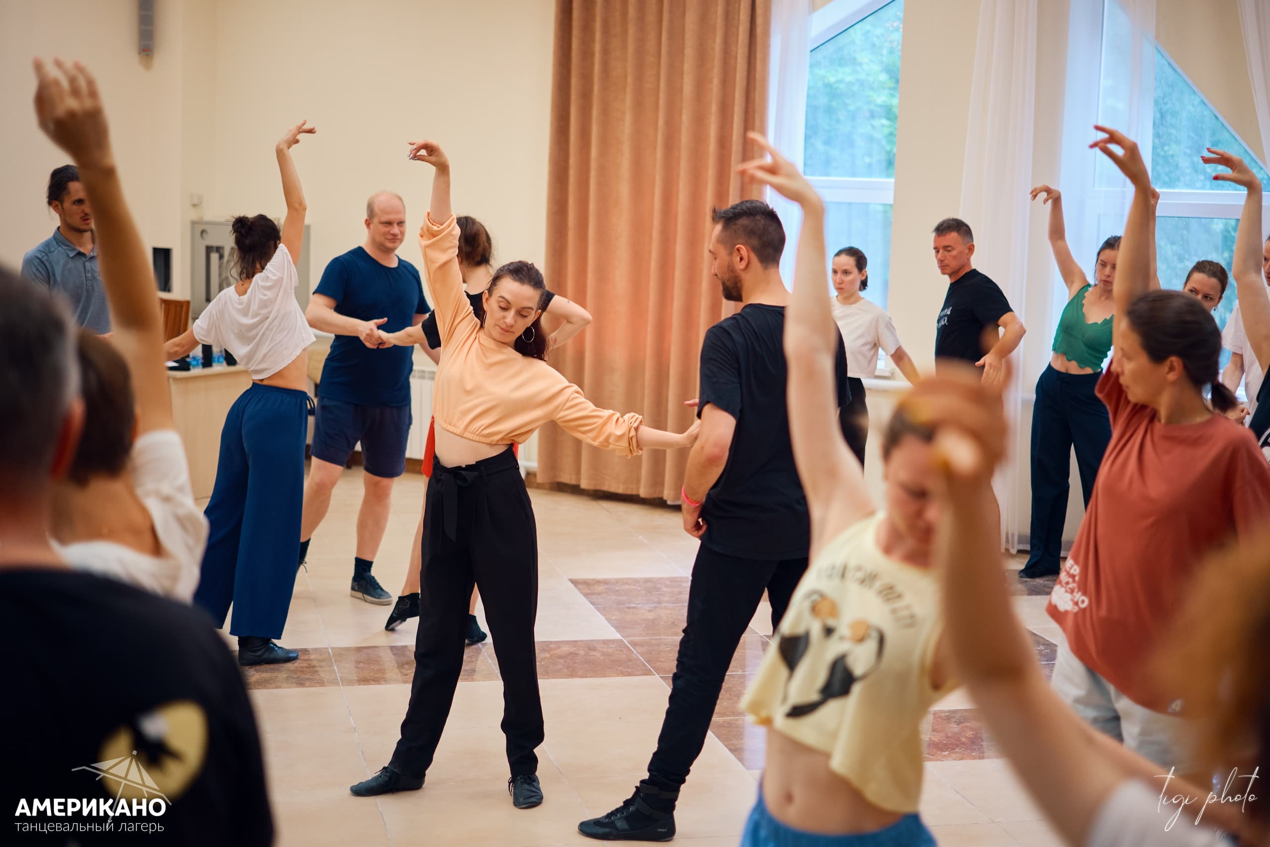 West Coast Swing dancers moving through a social floor